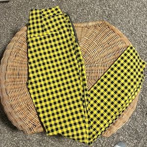 Woman’s black and yellow striped pants